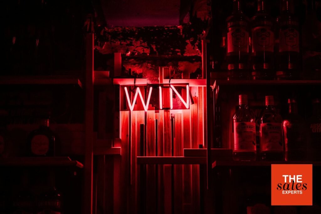 Red neon win sign for article about closing without pressure